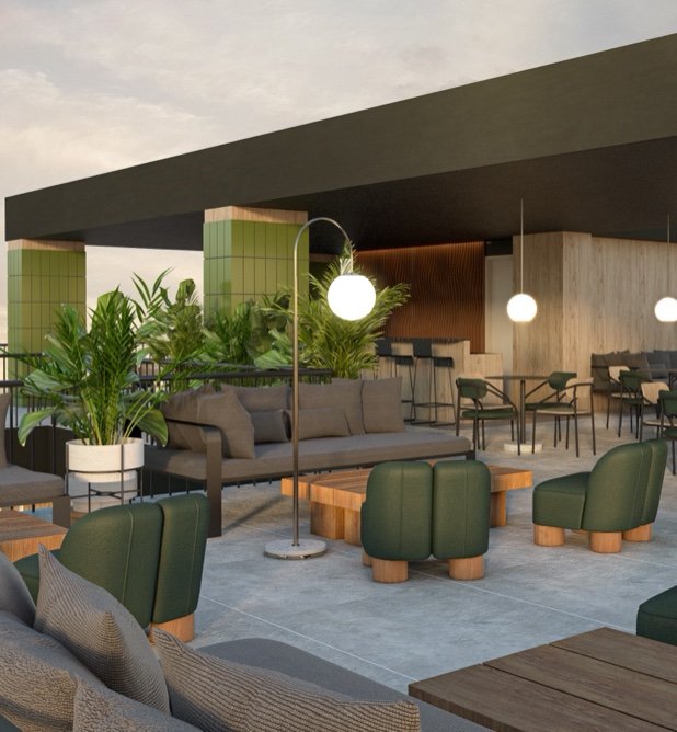 Lounge con plantas, barra y zona de trabajo