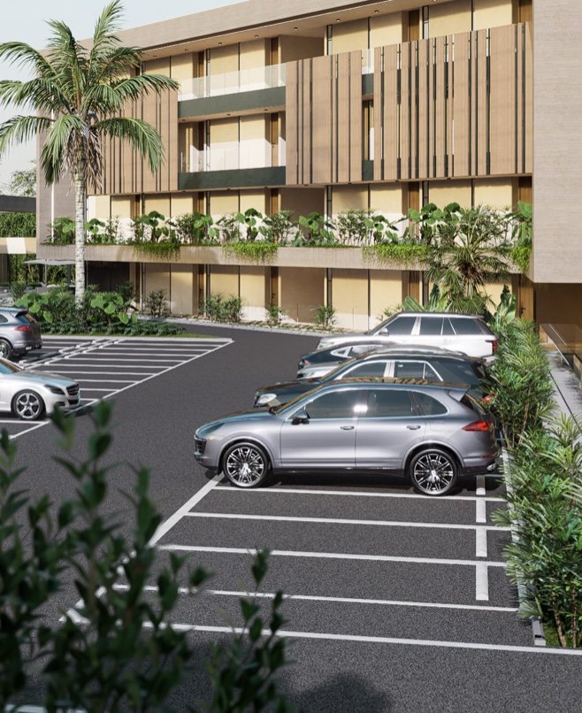 Fachada del proyecto con parqueaderos y jardines